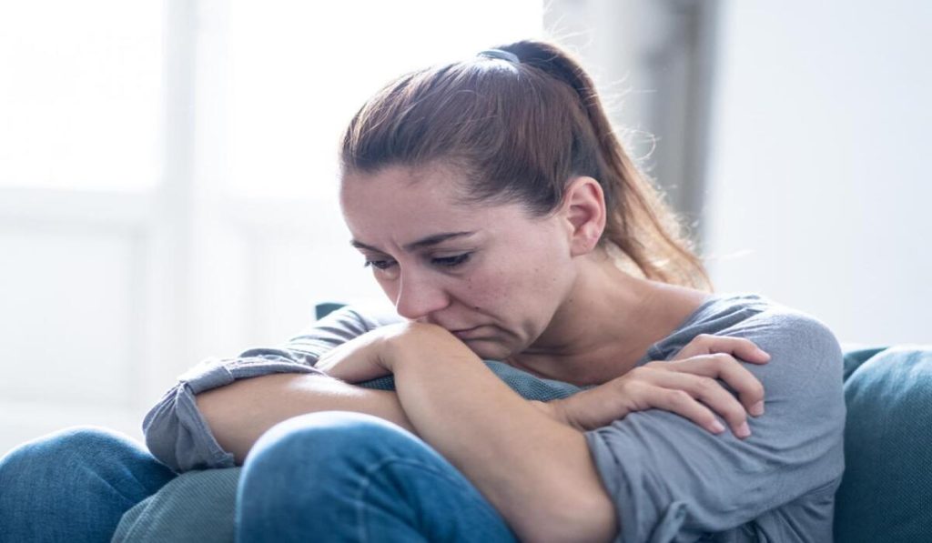 Woman suffering from depression due to oversleeping