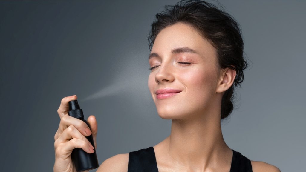 Woman using a setting spray 